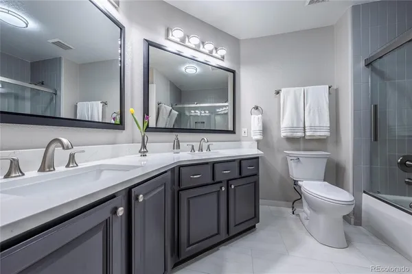 a spacious bedroom with a bed and a window