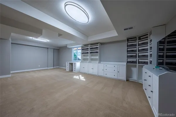 a view of a house with snow on the side of the road
