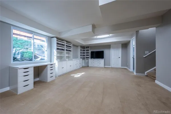 a view of a outdoor sitting area with furniture and umbrella
