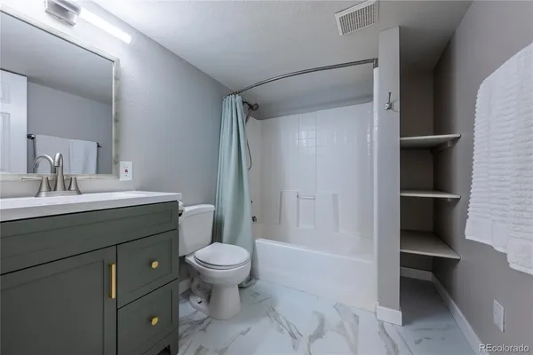 a view of a backyard with wooden fence