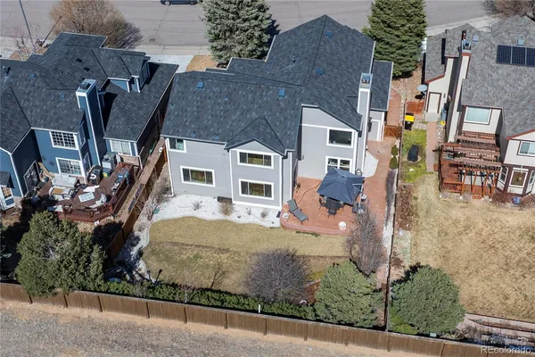 a view of a patio with a table and chairs