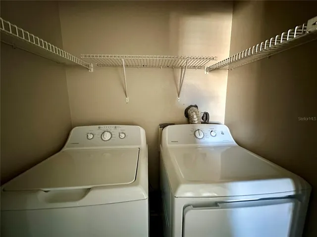 a utility room with dryer and washer