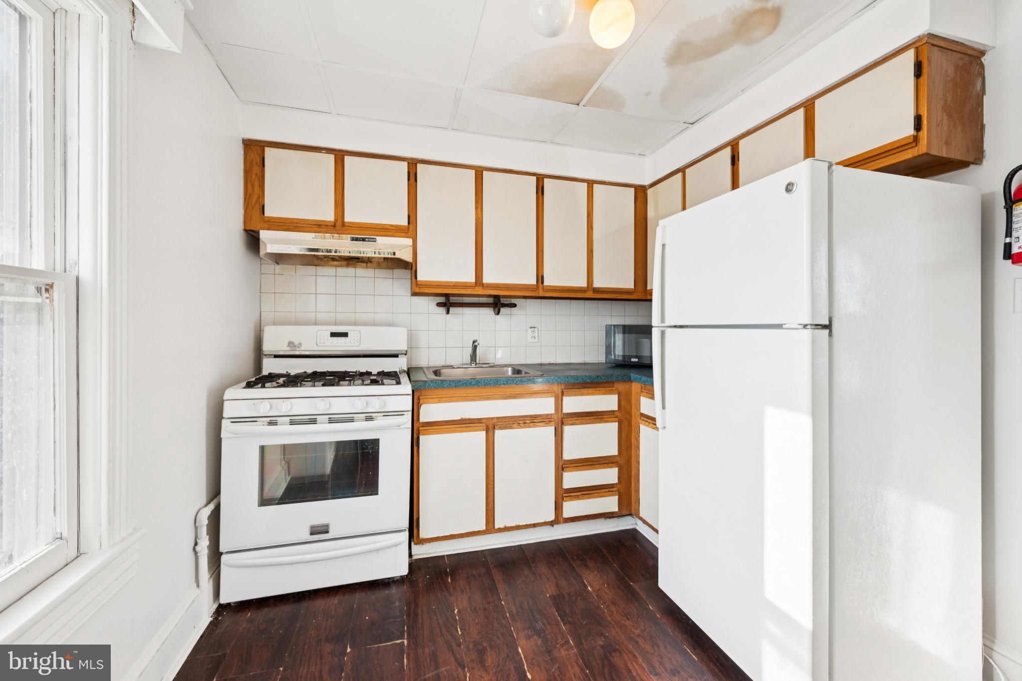 506 Bridgeboro Street Riverside, NJ 08075 - Photo 19 of 26 a white refrigerator freezer sitting in a kitchen