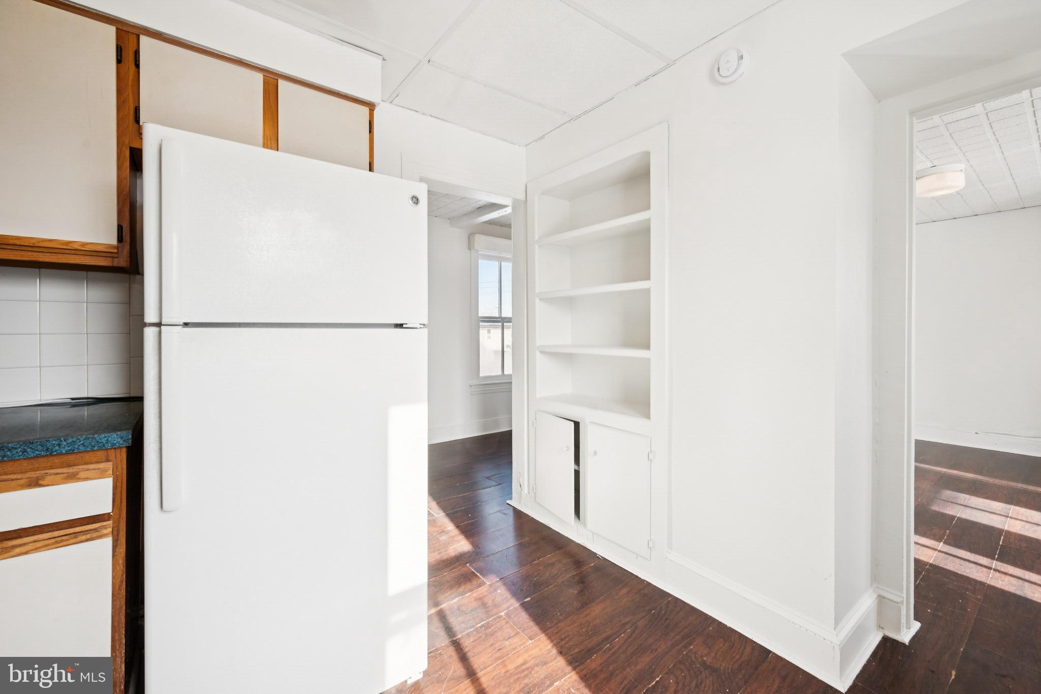 506 Bridgeboro Street Riverside, NJ 08075 - Photo 20 of 26 a white refrigerator freezer and a stove sitting inside of a kitchen