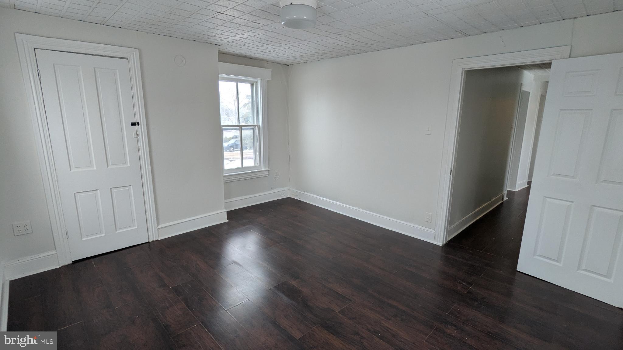 506 Bridgeboro Street Riverside, NJ 08075 - Photo 22 of 26 an empty room with wooden floor and window