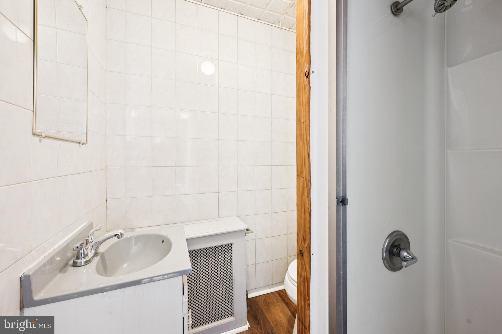506 Bridgeboro Street Riverside, NJ 08075 - Photo 23 of 26 a bathroom with a sink and mirror