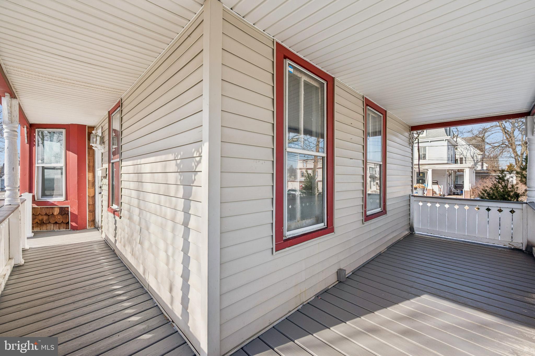 506 Bridgeboro Street Riverside, NJ 08075 - Photo 5 of 26 a view of a porch with wooden floor and furniture