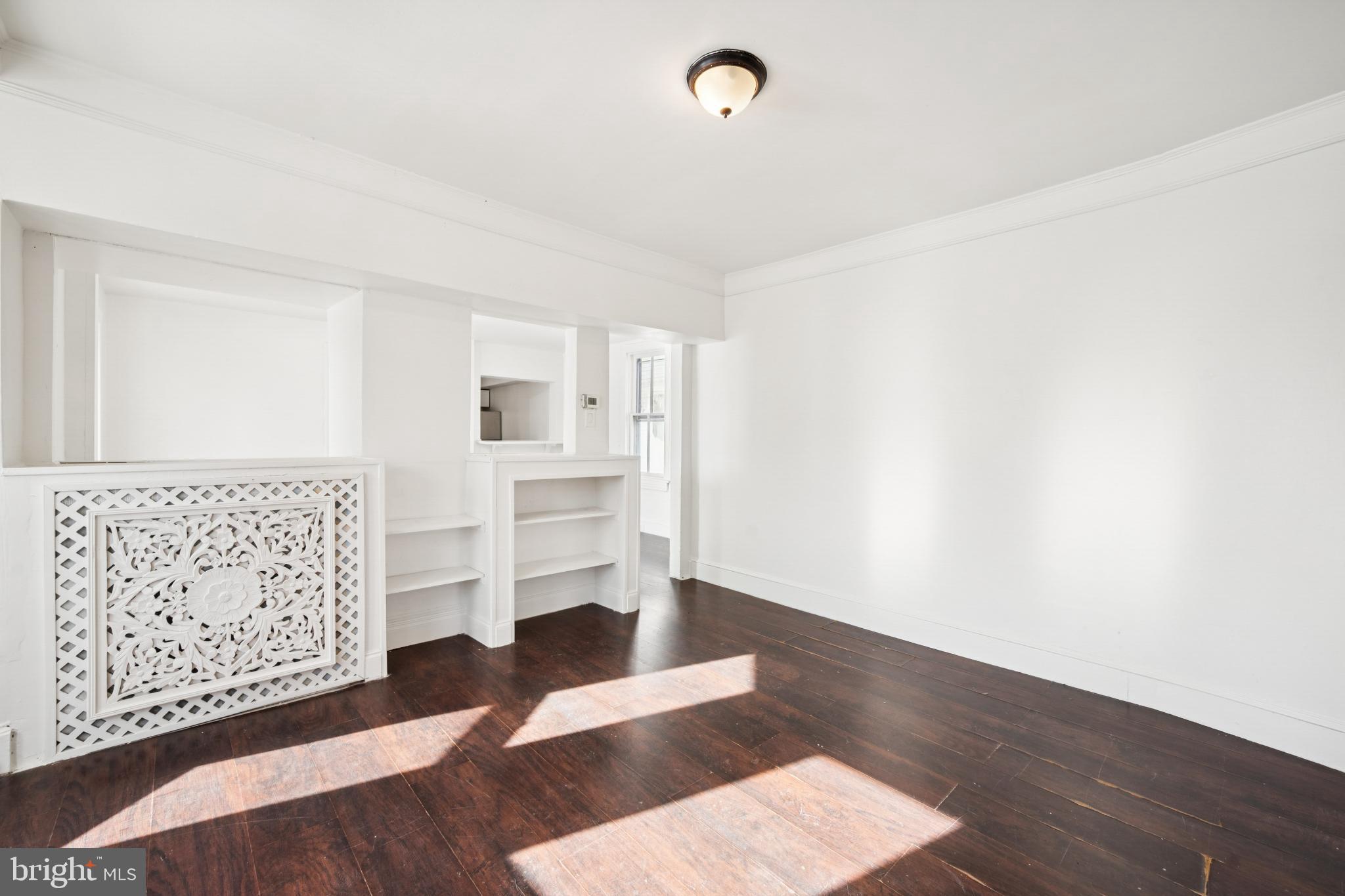 506 Bridgeboro Street Riverside, NJ 08075 - Photo 6 of 26 a view of wooden floor and windows in a room