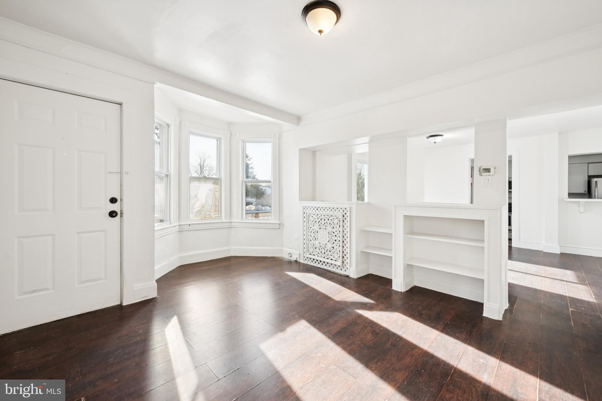 506 Bridgeboro Street Riverside, NJ 08075 - Photo 7 of 26 wooden floor in an empty room with a window
