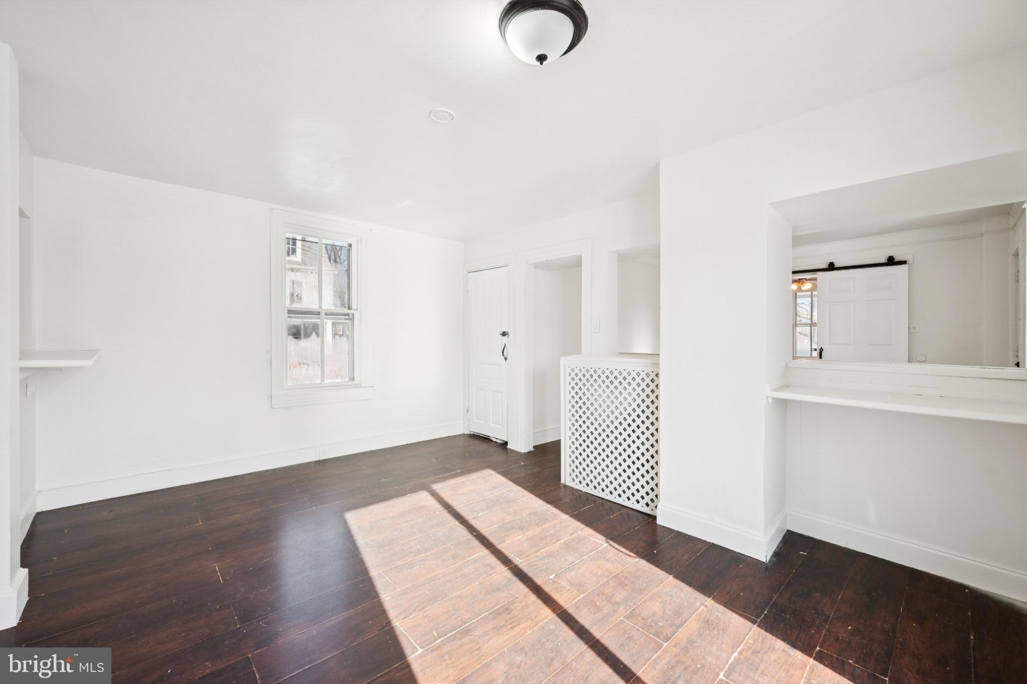 506 Bridgeboro Street Riverside, NJ 08075 - Photo 9 of 26 a view of a room with wooden floor and window