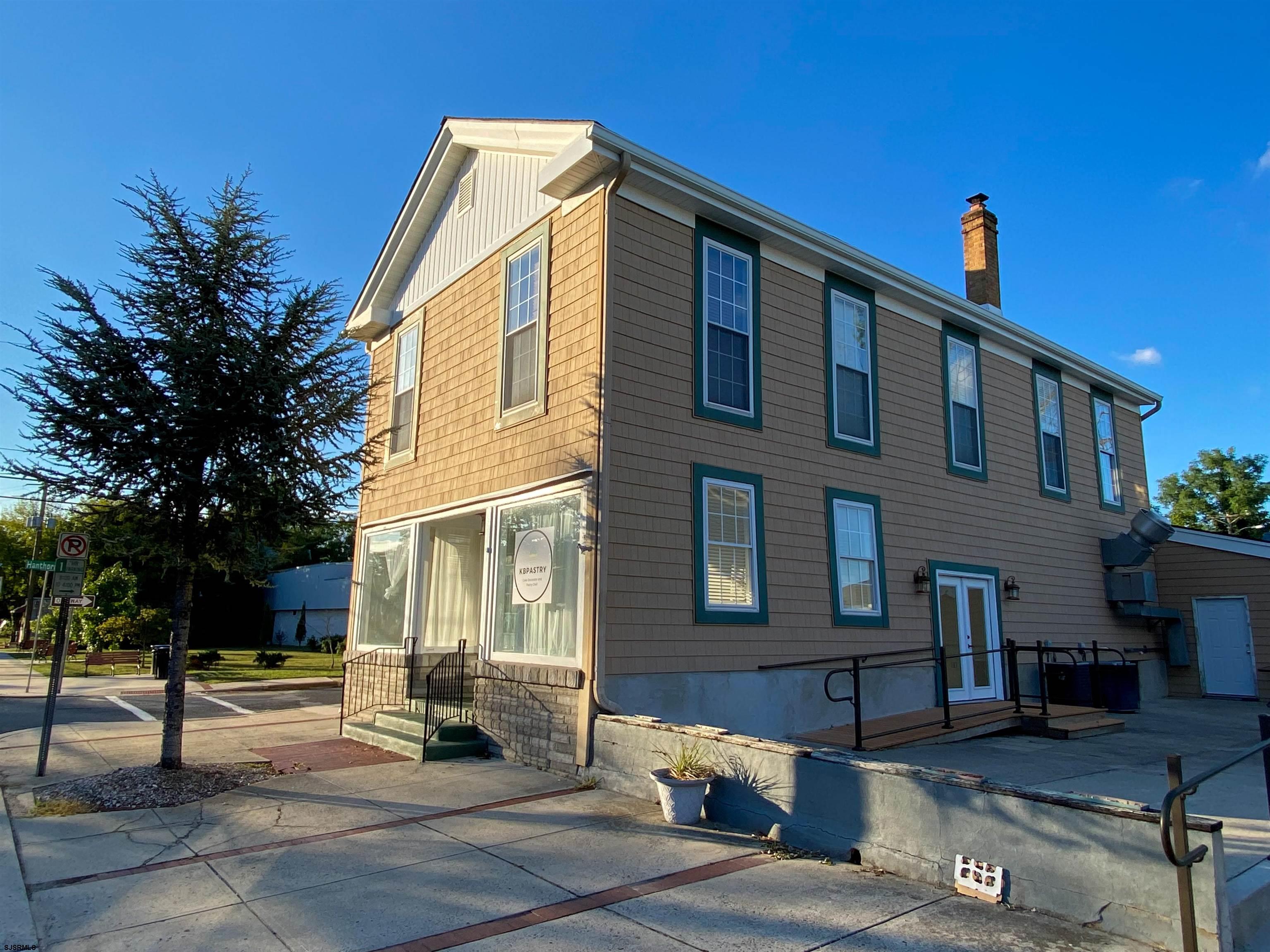 6019 Main Street, Unit 2 Mays Landing, NJ 08330 - Photo 25 of 26 a front view of a house with a yard