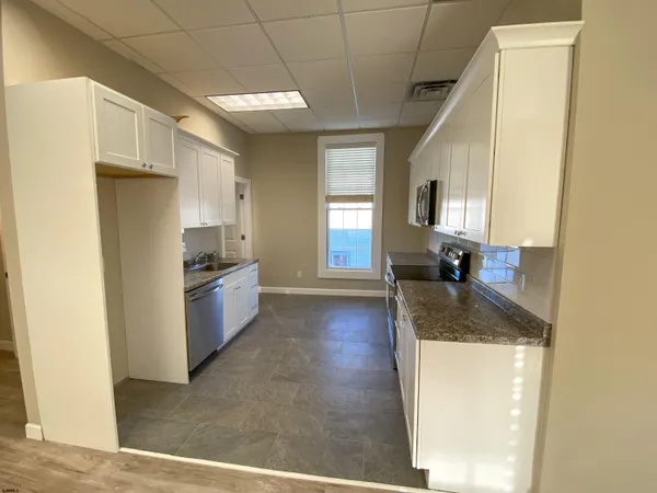 a view of a room with wooden floor and closet