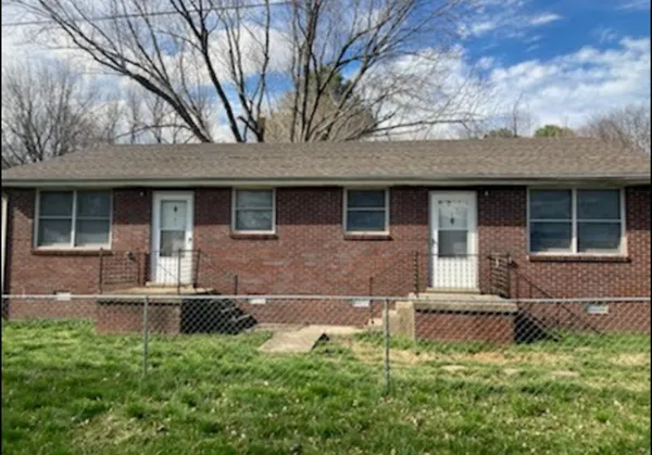 a backyard of a house with seating space