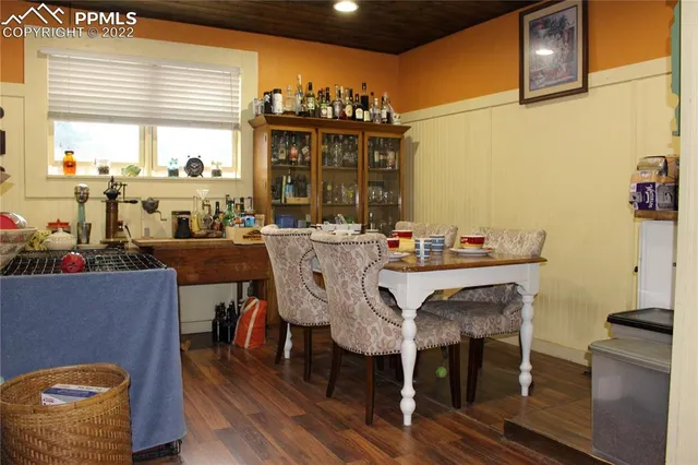 a view of a dining room with furniture and window
