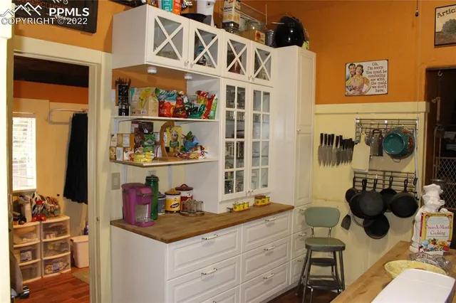 a room with furniture a rug and a window