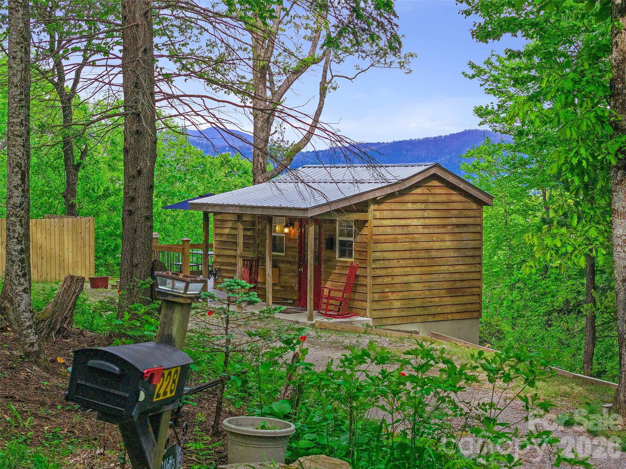 228 Continental Divide Road Spruce Pine, NC 28777 - Photo 37 of 48 a backyard of a house with seating space