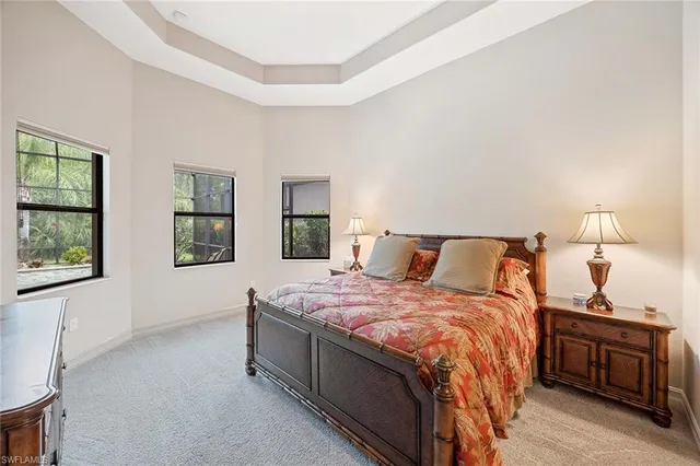 a bedroom with bed and window