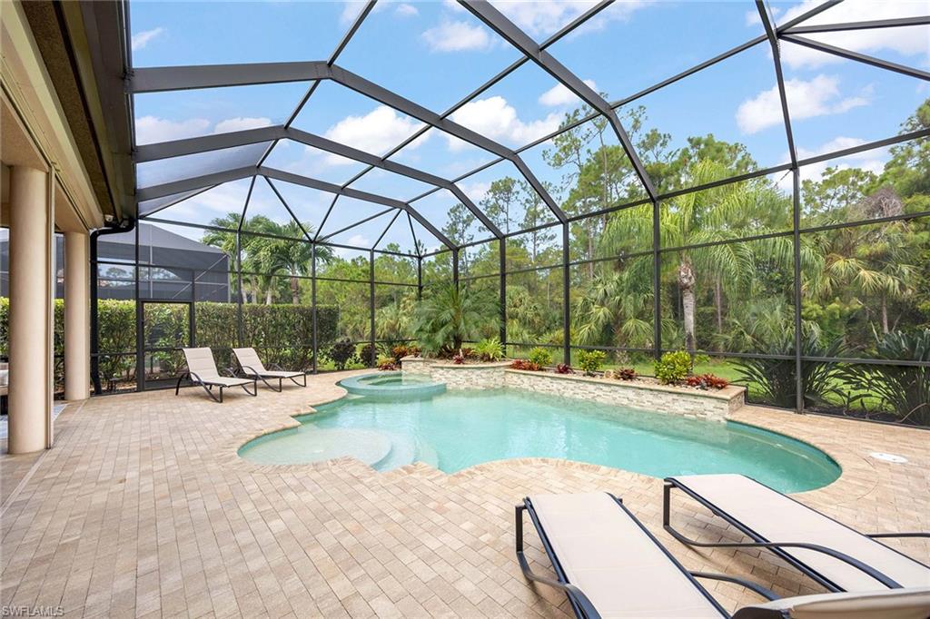 6255 Brunello Lane Naples, FL 34113 - Photo 28 of 37 a view of a swimming pool with a patio