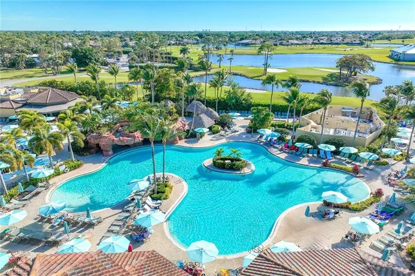 a view of a swimming pool and lounge chair