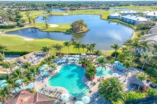 a view of a swimming pool with a yard