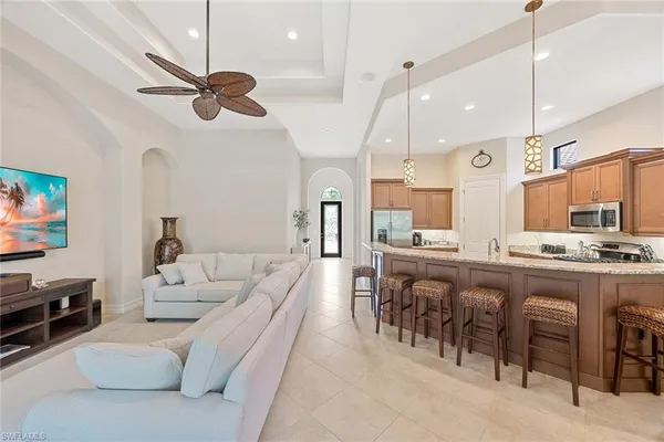 a large kitchen with a table and chairs