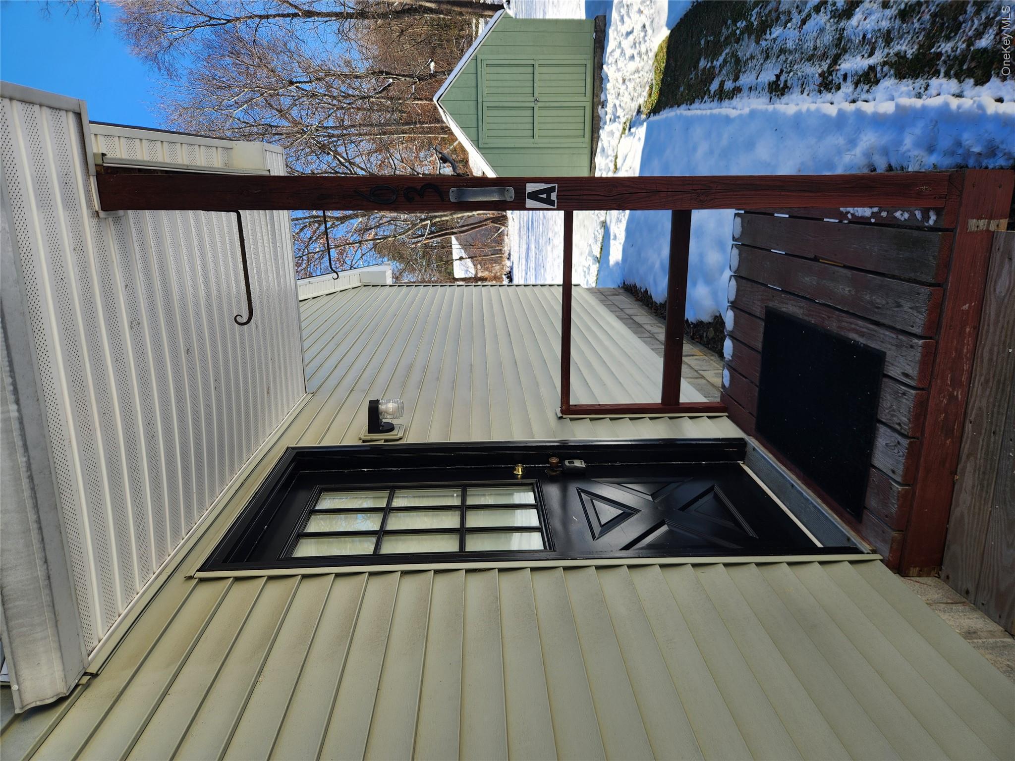 63 Jefferson Road, Unit A Red Hook, NY 12571 - Photo 11 of 13 a view of a house with a door and wooden floor