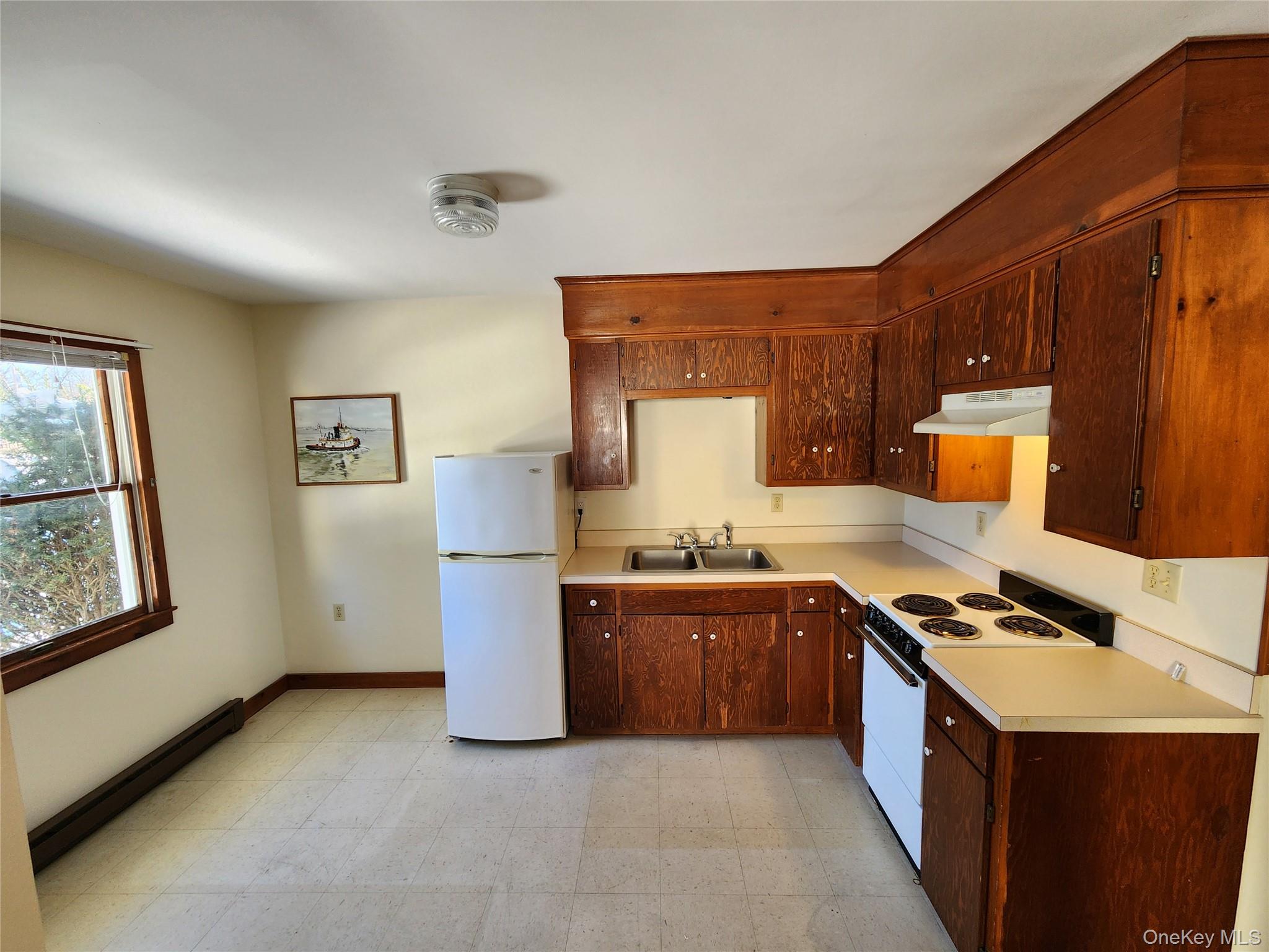 63 Jefferson Road, Unit A Red Hook, NY 12571 - Photo 4 of 13 a kitchen with stainless steel appliances granite countertop a stove sink and cabinets
