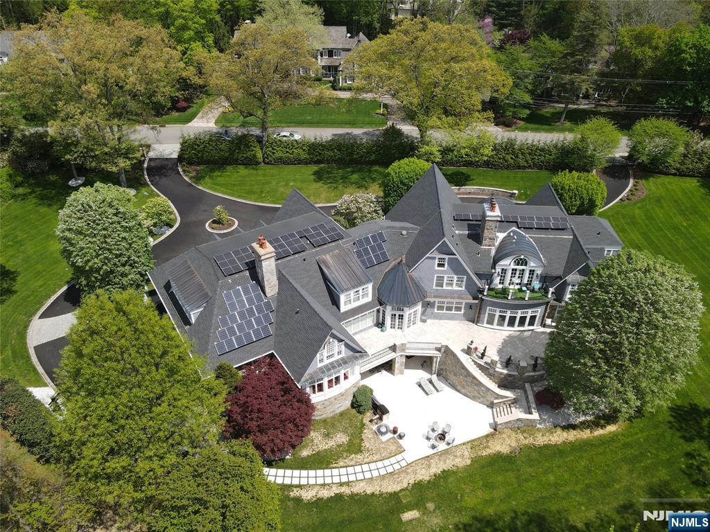 an aerial view of a house with outdoor space