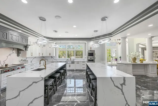 a kitchen with a stove a sink and a refrigerator