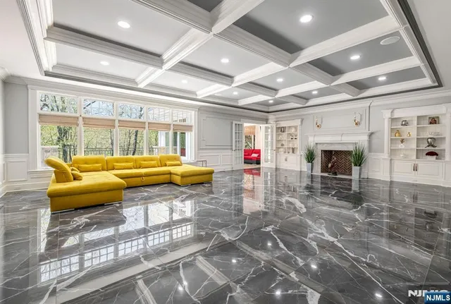 a living room with furniture and windows
