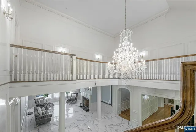 a spacious bedroom with a bed and wooden floor