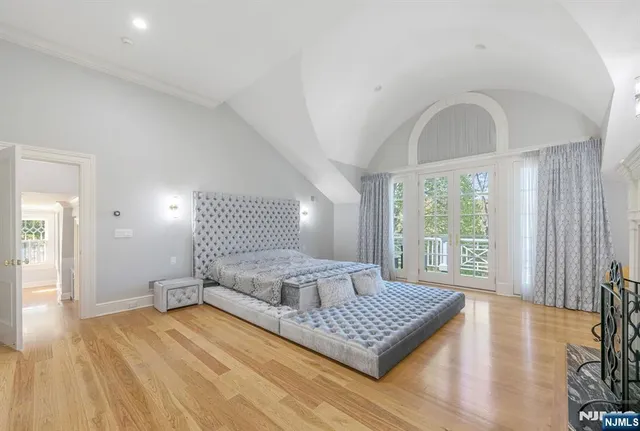 a spacious bathroom with a bathtub and shower