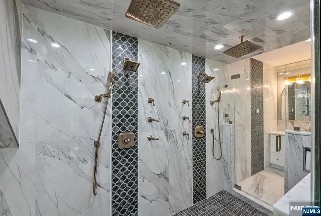 a spacious bedroom with a bed and a wooden floor