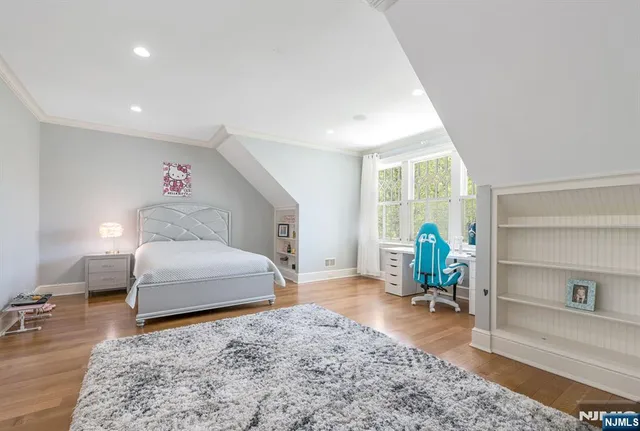 a kitchen with kitchen island a stove a table and chairs in it