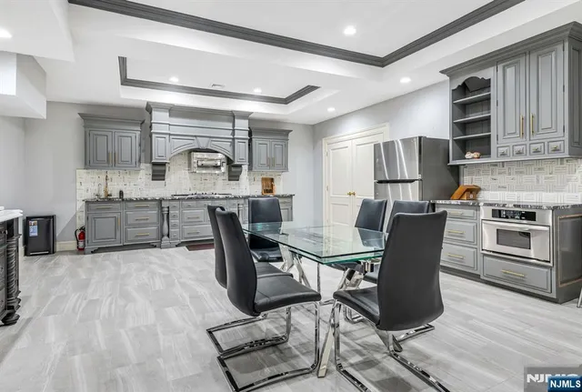 a view of a table and chairs in the garden