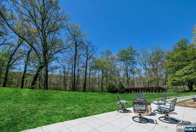 a view of a brick house with large windows