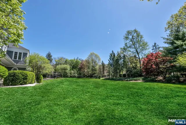 a sign that is sitting on a lush green field