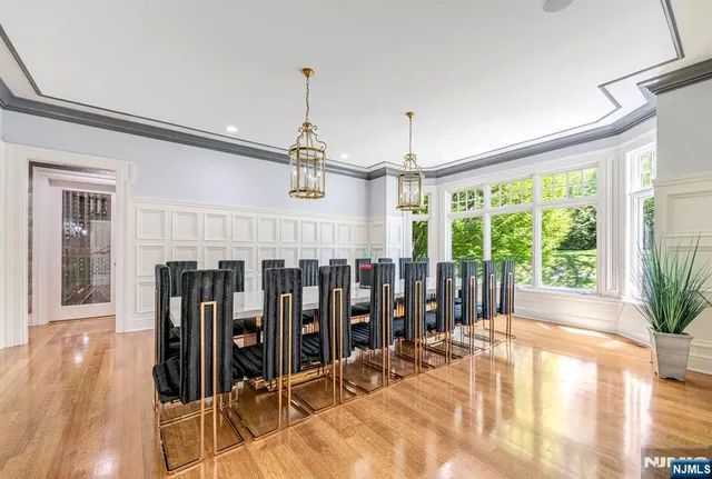 a living room with furniture a fireplace and a large window