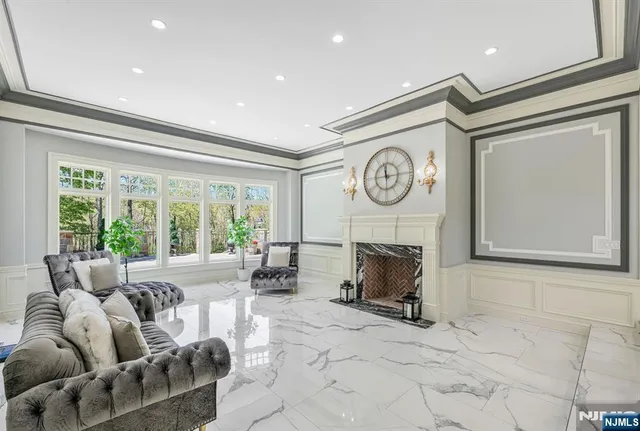 a view of a livingroom with wooden floor and staircase