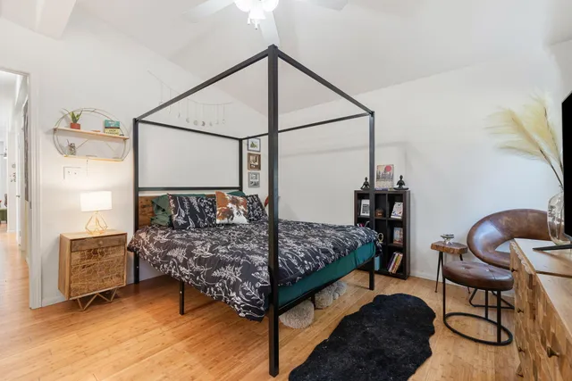 a view of a livingroom with furniture window and wooden floor