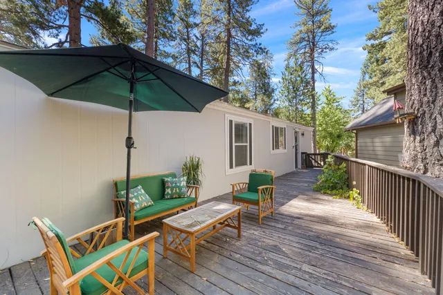 a kitchen with stainless steel appliances a sink a stove and a window