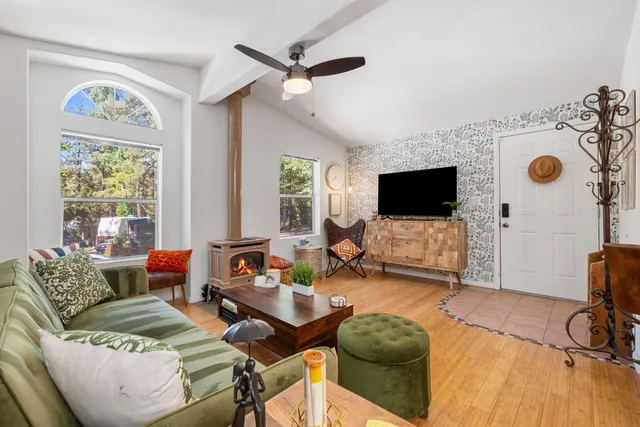 a dining room with furniture and wooden floor