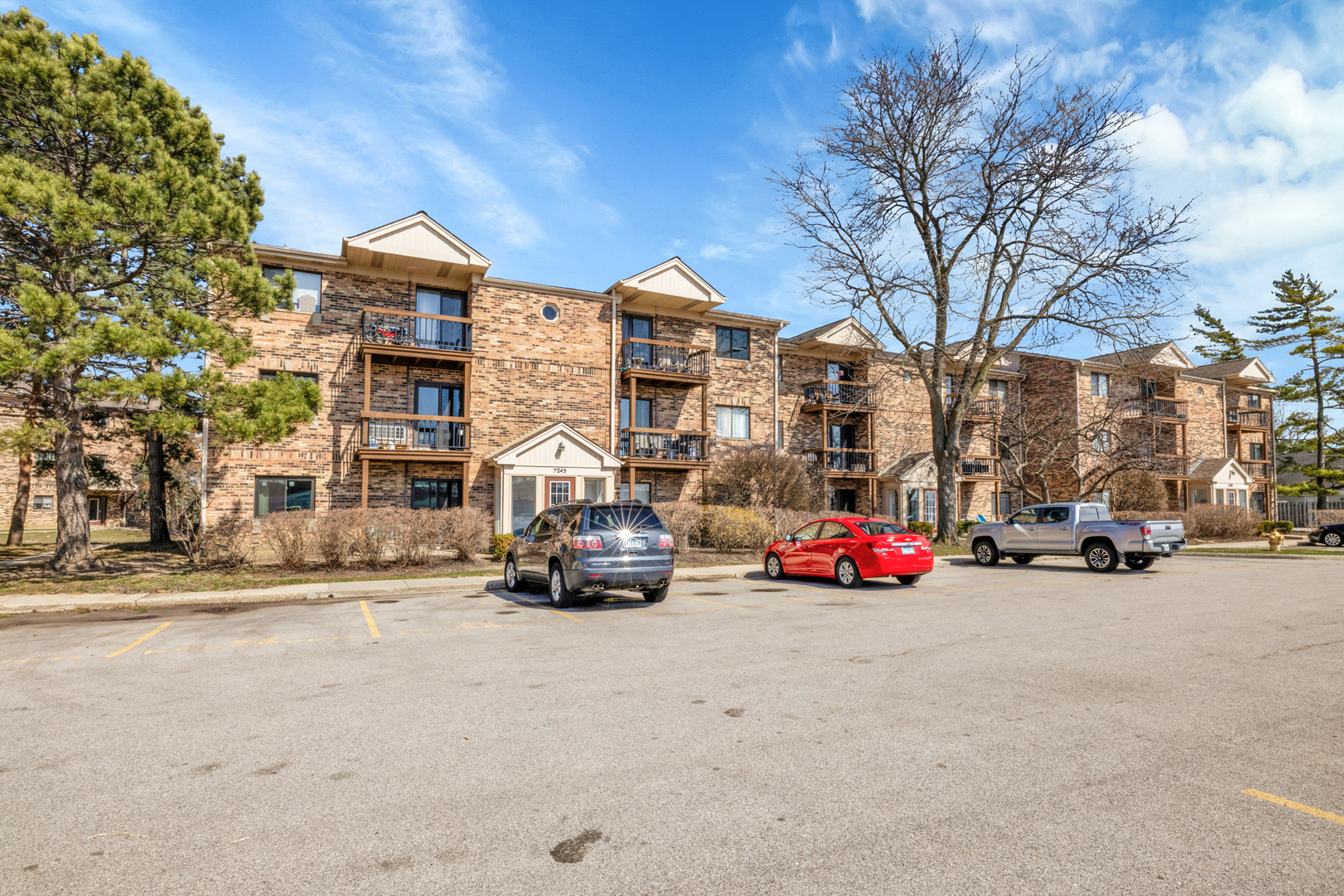 2245 West Nichols Road, Unit C Arlington Heights, IL 60004 - Photo 14 of 16 a car parked in front of a building