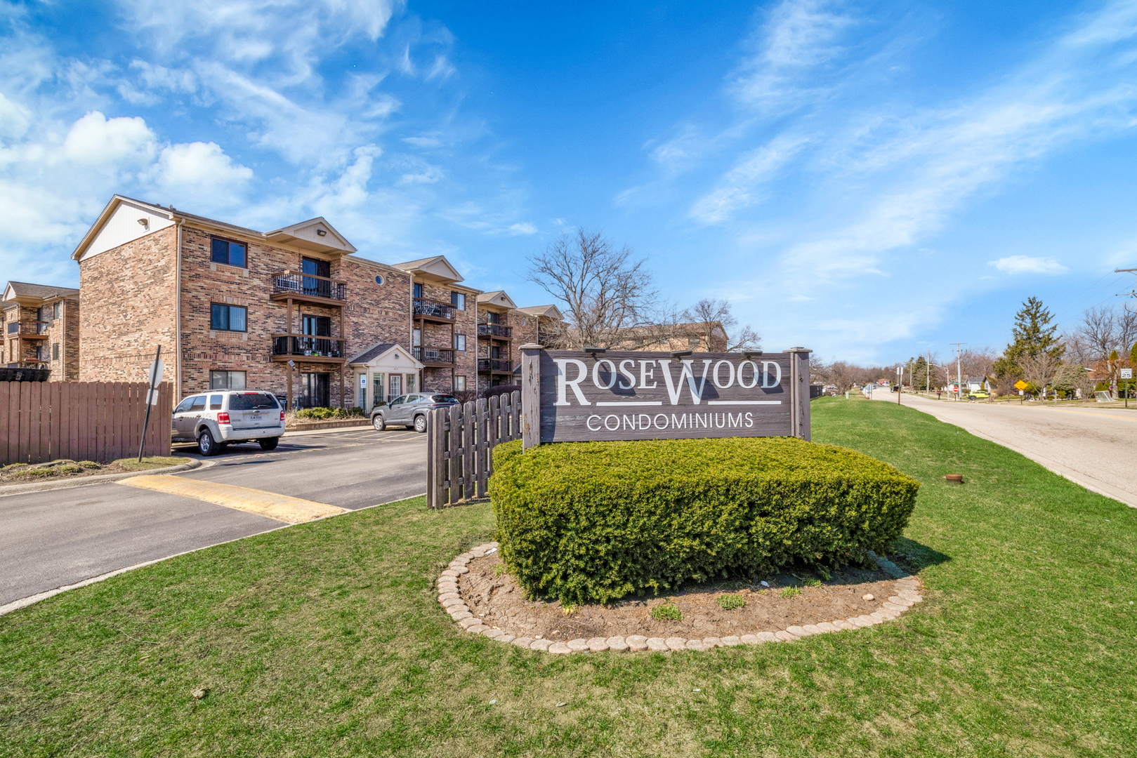 2245 West Nichols Road, Unit C Arlington Heights, IL 60004 - Photo 2 of 16 a sign board with a play ground in the back