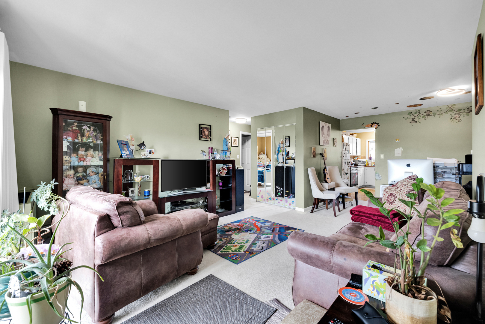 2245 West Nichols Road, Unit C Arlington Heights, IL 60004 - Photo 3 of 16 a living room with furniture and a flat screen tv