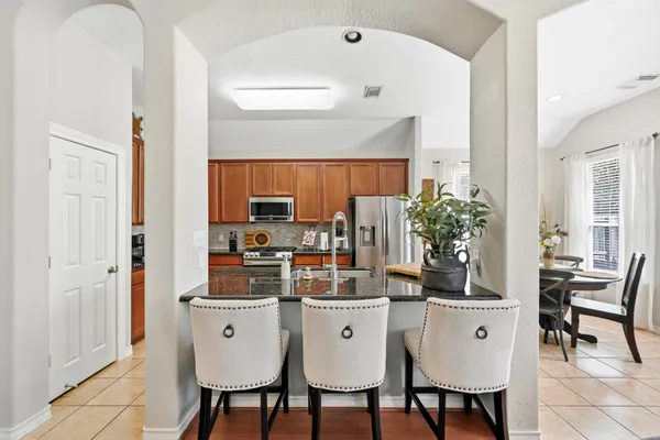 a dining room with furniture and window