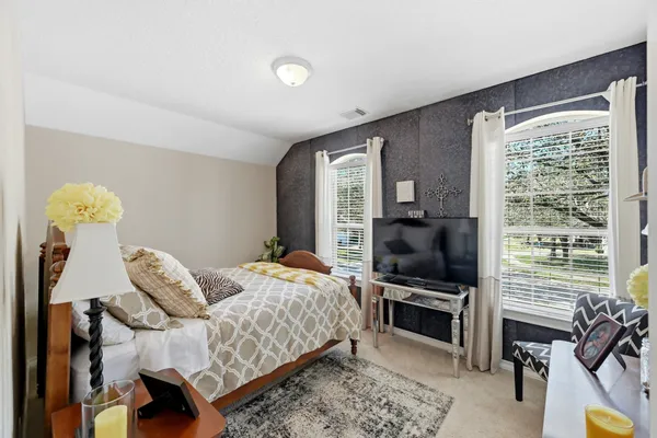 a bedroom with a bed and a cabinets