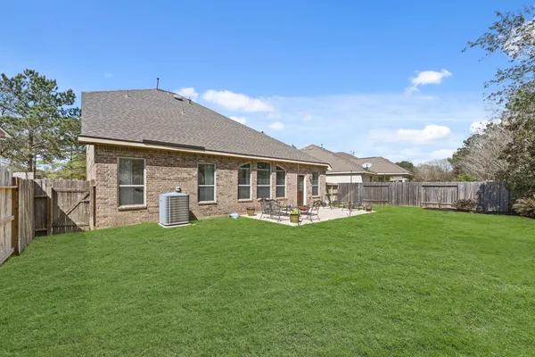 a front view of house with yard patio and green space