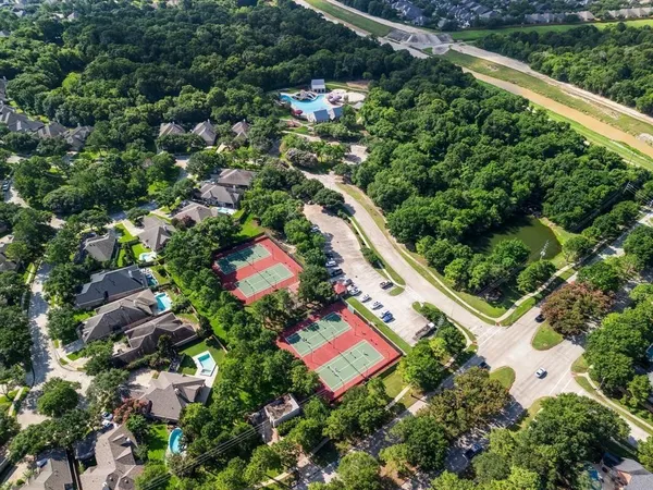 an aerial view of a house with pool garden