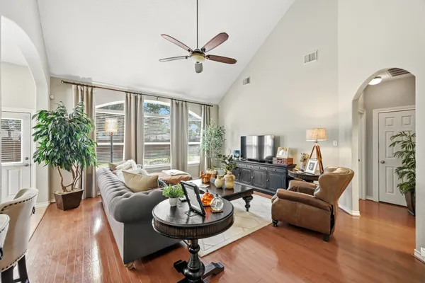 a living room with furniture and a large window
